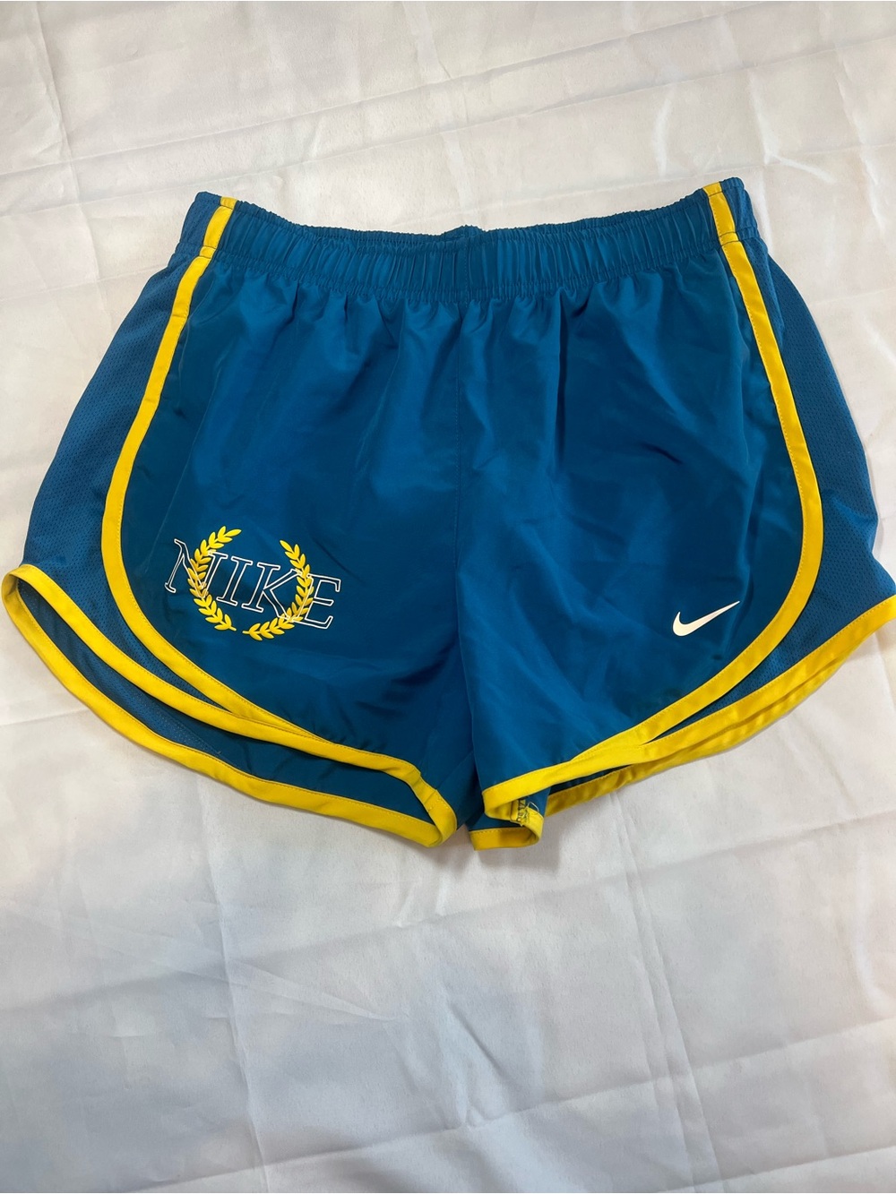 Nike Women's Teal Athletic Shorts with Yellow Trim